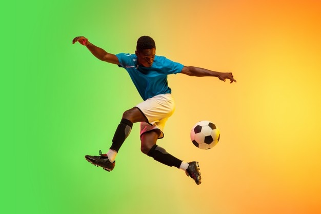 male soccer football player training in action isolated on gradient studio in neon light 155003 15990